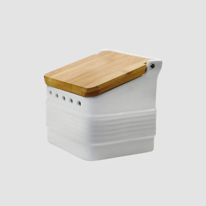 White stoneware garlic keeper for kitchen counter