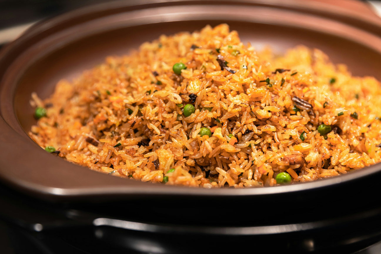 A pot of yellow arroz con gandules made with sazón — Puerto Rican rice with pigeon peas