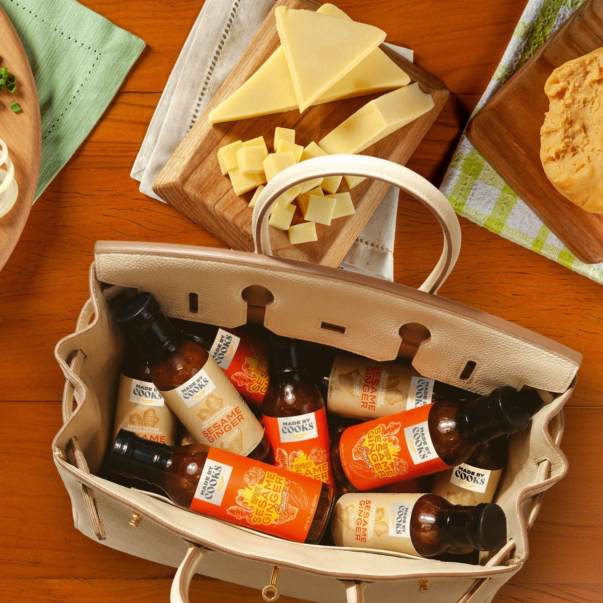 An open bag packed with bottles of Made By Cooks sesame and ginger sauce; the Duo itself contains two bottles, one Original and one Spicy