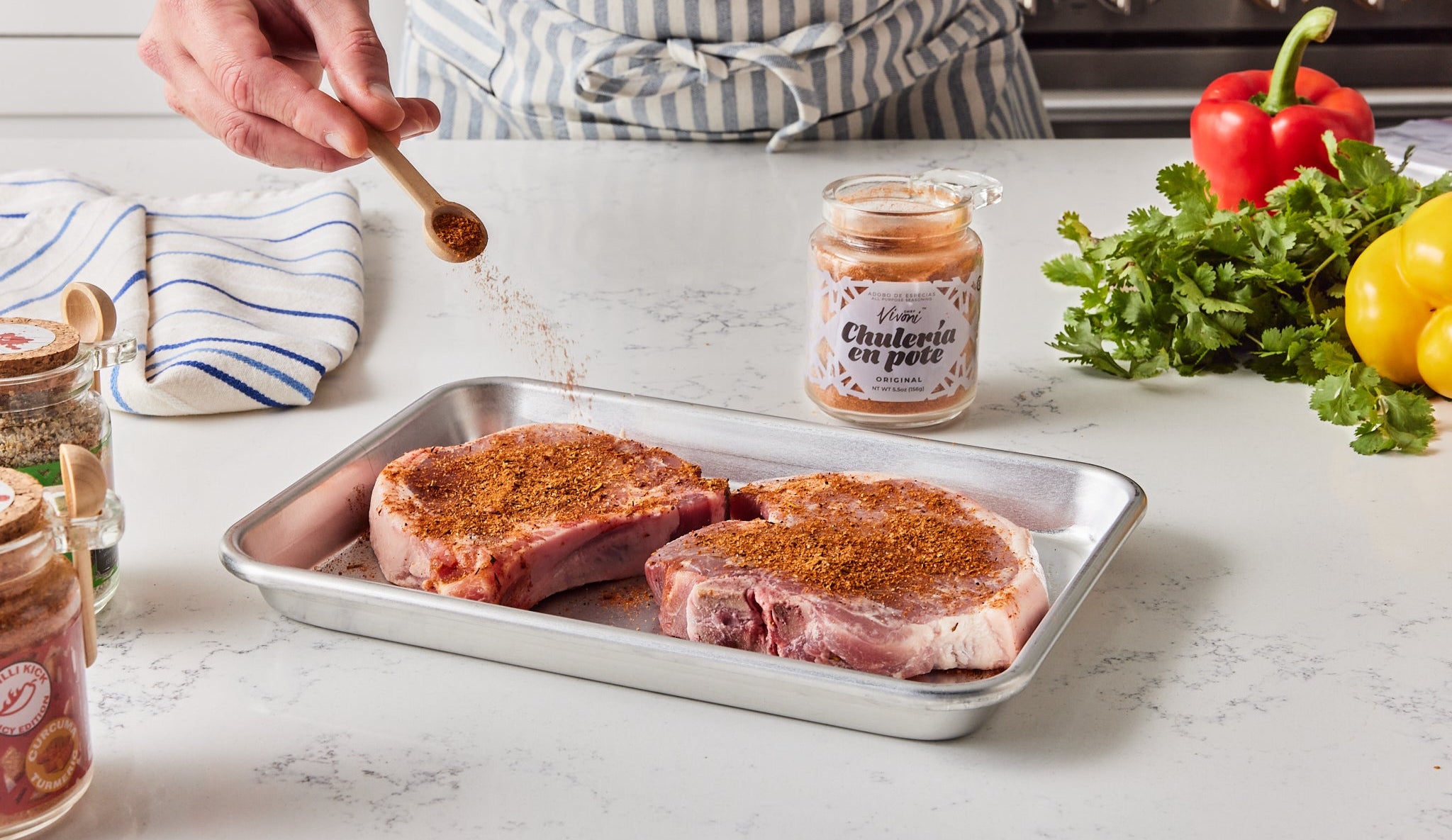 Chulería en Pote seasoning jars on a Puerto Rican kitchen counter
