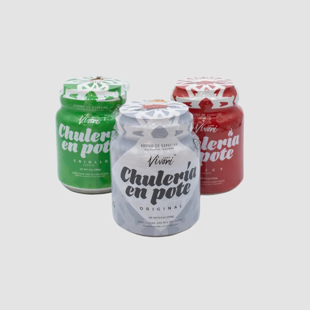 Three jars of Chulería en Pote side by side — green Criollo, white Original and red Spicy — with labels facing forward